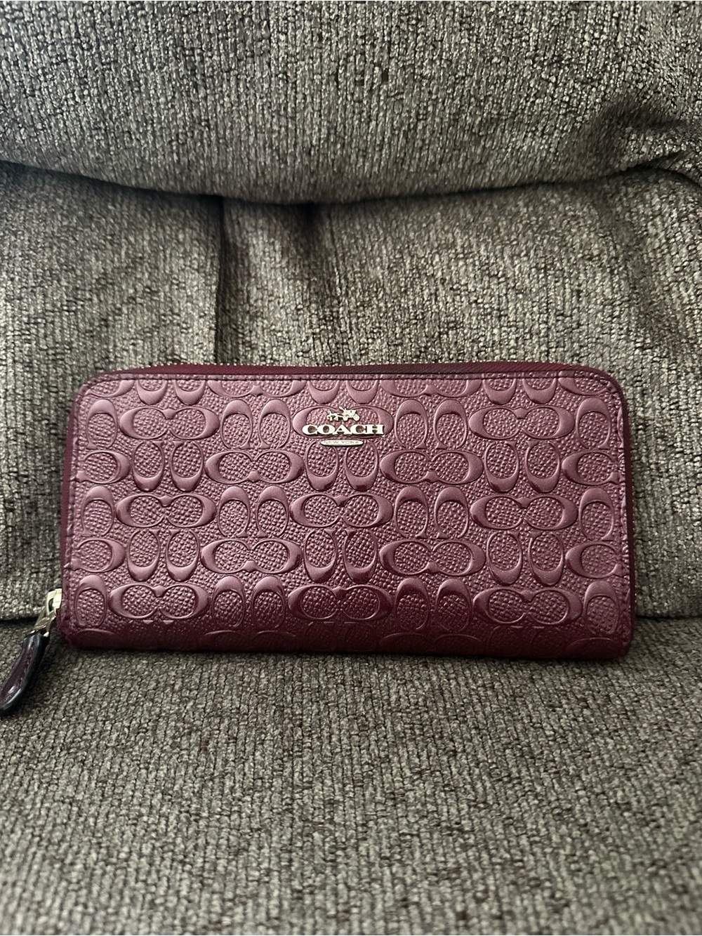 COACH Embossed Signature Zip Wallet in Deep Berry
